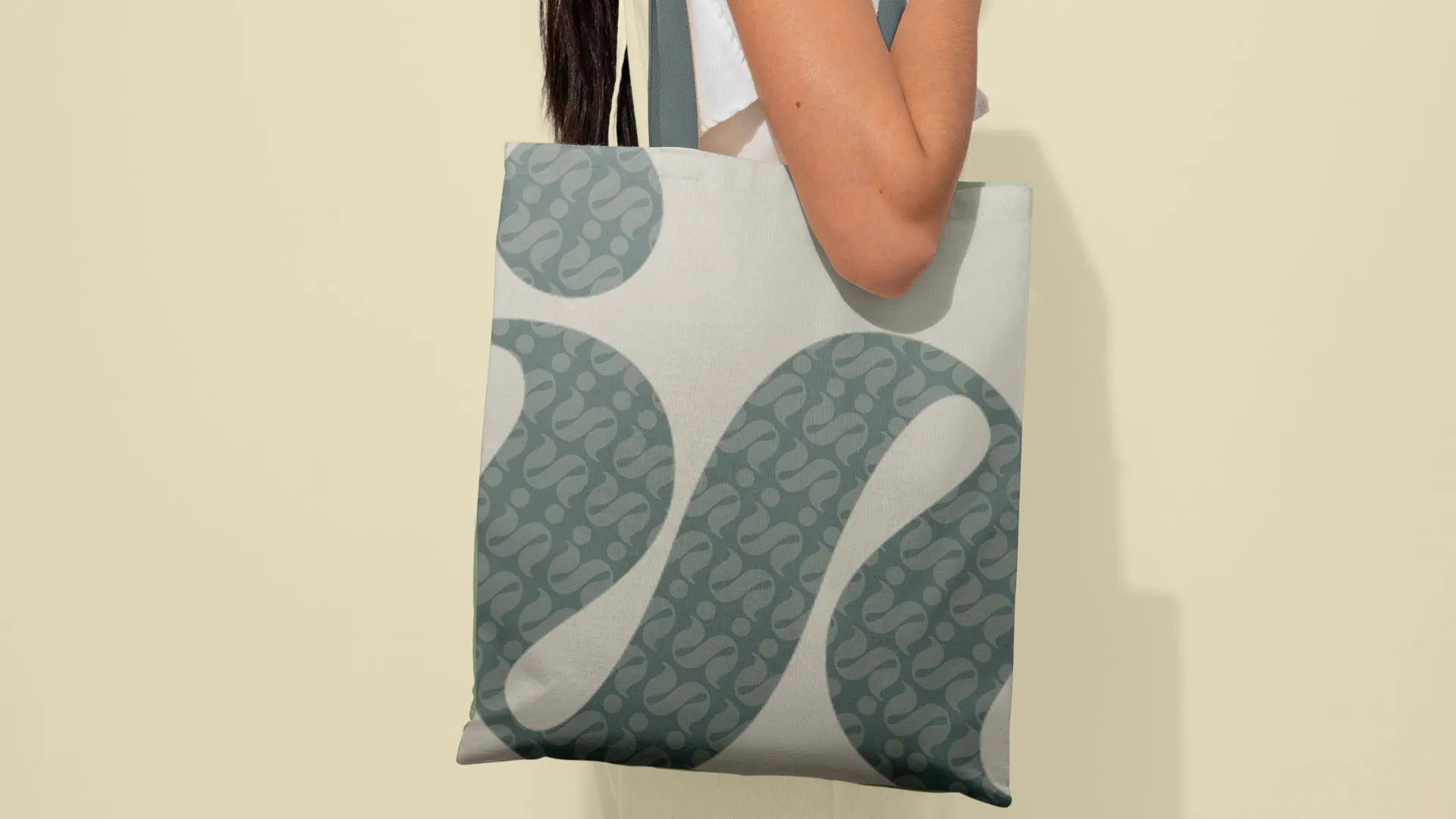 A tote bag with the pattern built from the mark