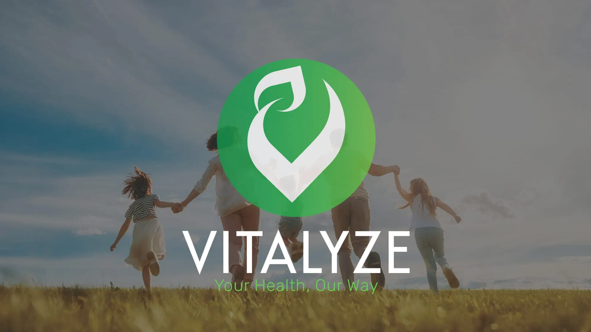 The Vitalyze logo over a family running through a field